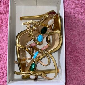 Jewels studded gold heels